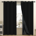 Black grommet-top curtains beside a window